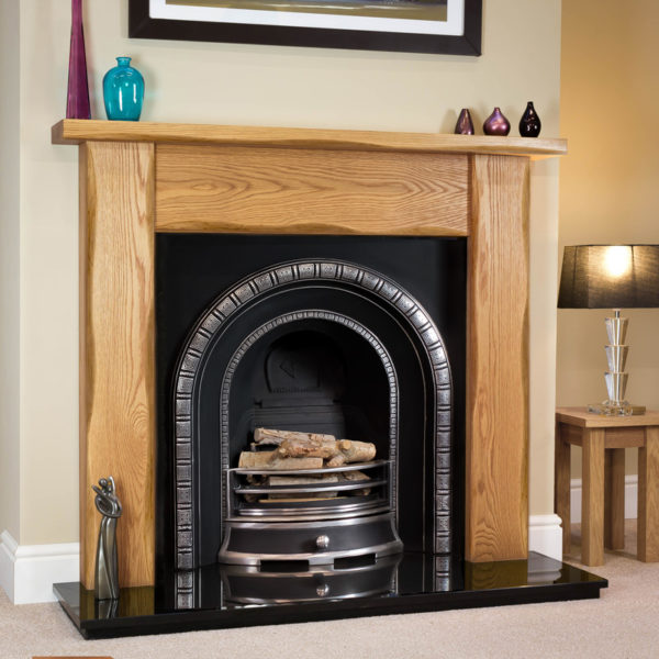 Waney Edge Straight Oak fireplace surround shown in a light oak finish with a Henley cast iron arch insert